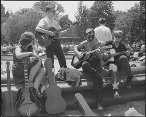 Bearded guitarist with other musicians, Washington Square Park